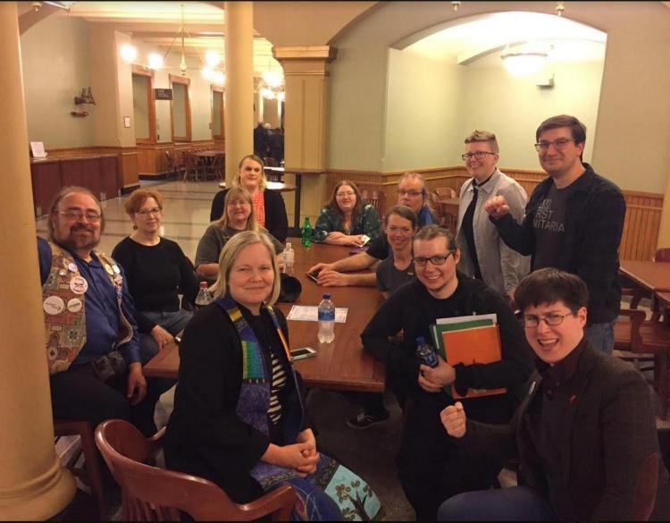 Members of the Trans Action Group pose at the Iowa Capitol with the First Unitarian Social Justice Minister and the Downtown Disciples Minister.